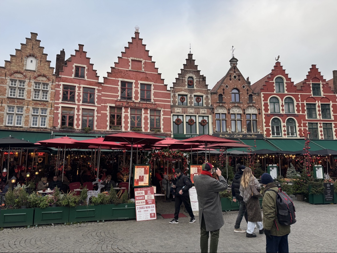Bruges' gabled market square with cafés decked out for Christmas