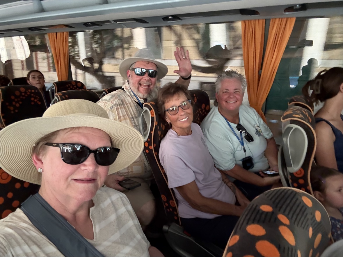 Anne Conrad traveling with a happy tour group